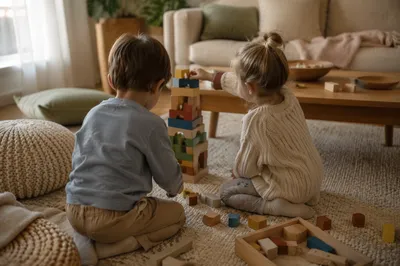 Siblings Building Blocks in Cozy Living Room