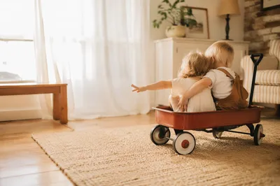 Siblings Playing in Cozy Sunlit Living Room