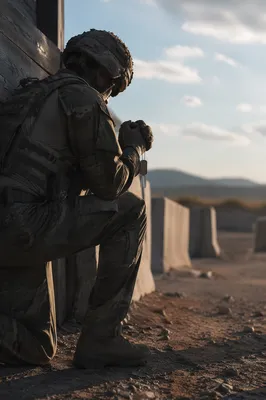 Soldier Kneeling in Prayer with Dog Tags