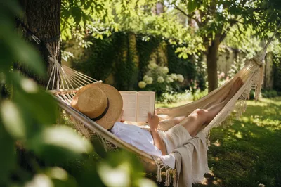 Relaxing Summer Hammock Reading Under Shade Trees