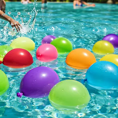 Colorful Water Balloons in Summer Pool