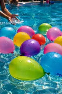 Colorful Water Balloons in Summer Pool