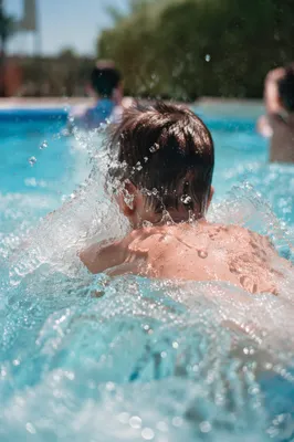 Kids Splashing at Summer Pool Party
