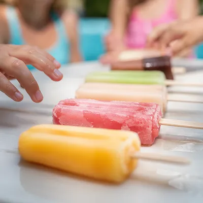 Kids Reaching for Summer Fruit Popsicles