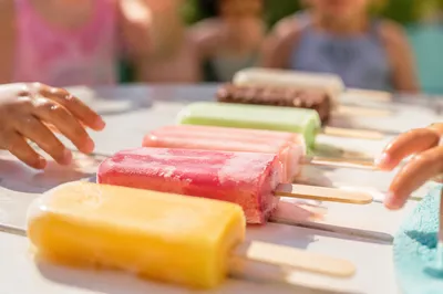 Kids Reaching for Summer Fruit Popsicles