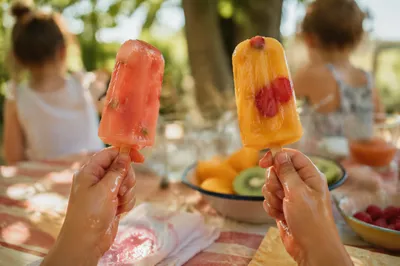 Kids Holding Melting Summer Fruit Popsicles