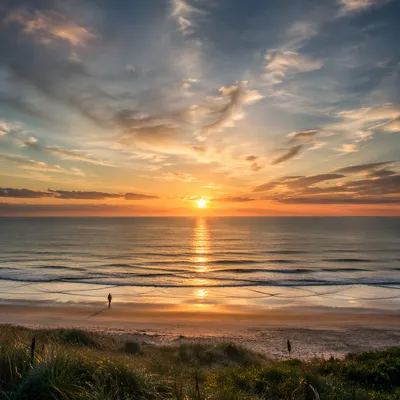 Peaceful Sunrise Over Calm Coastal Shore