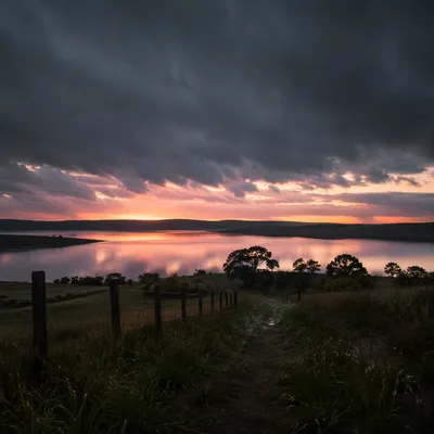 Peaceful Sunrise Over Lake After Storm