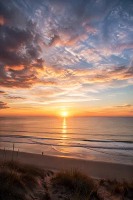 Peaceful Sunrise Over Calm Coastal Waters