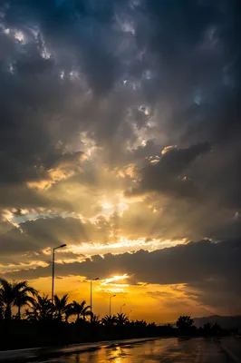 Peaceful Sunrise After Storm Over Silhouettes