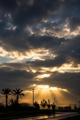 Peaceful Sunrise Breaking Through Storm Clouds