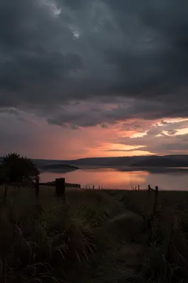 Peaceful Sunrise Over Lake After Storm