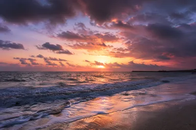 Peaceful Sunrise Over Storm Washed Shore