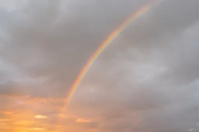 Peaceful Sunrise Rainbow After Storm