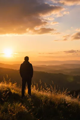 Silhouette on Hill at Golden Sunset