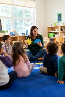 Preschool Teacher Leading Story Time Circle