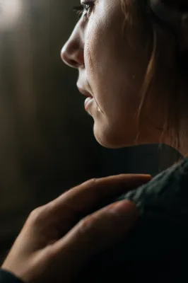 Tearful Cheek with Comforting Hand