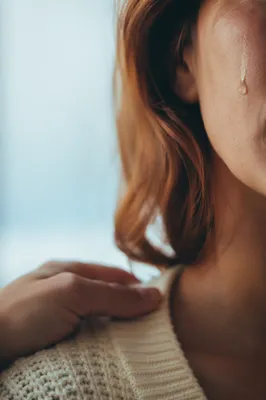 Tender Tear and Comforting Hand Close Up