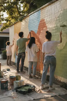 Volunteers Painting a Hopeful Community Mural