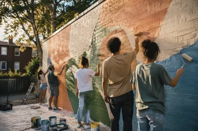 Volunteers Painting a Hopeful Community Mural