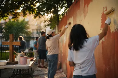 Church Volunteers Painting a Community Wall