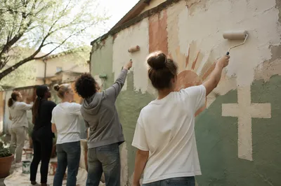 Church Volunteers Painting Hopeful Community Mural