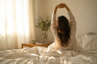 Peaceful Morning Stretch in Sunlit Bedroom