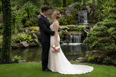Romantic Garden Wedding Couple by Waterfall