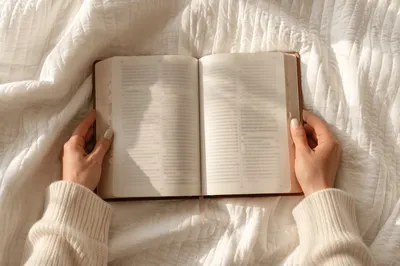 Woman Reading Bible on Cozy Blanket