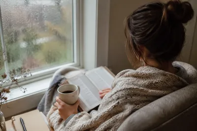 Cozy Morning Bible Devotion by Rainy Window