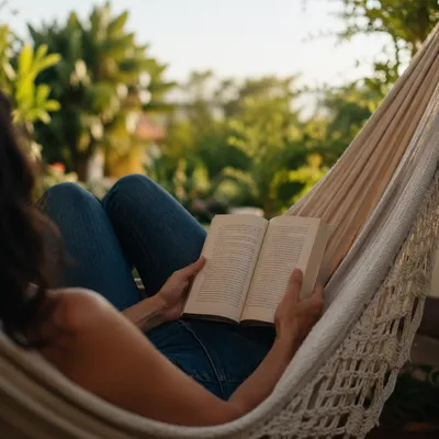 Woman Reading in Garden Hammock