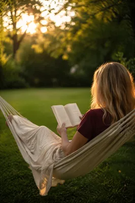 Woman Reading Peacefully in Garden Hammock