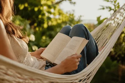 Woman Reading in a Garden Hammock