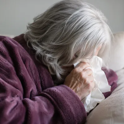 Older Woman Wiping Tears in Quiet Comfort
