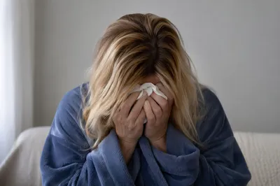 Woman Wiping Tears in Quiet Comfort