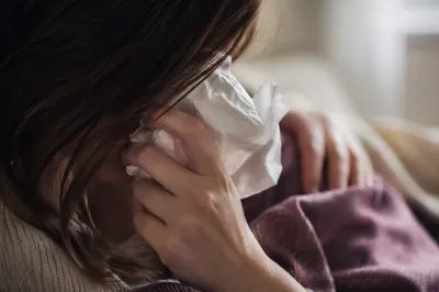 Comforting Woman Wiping Tears Indoors