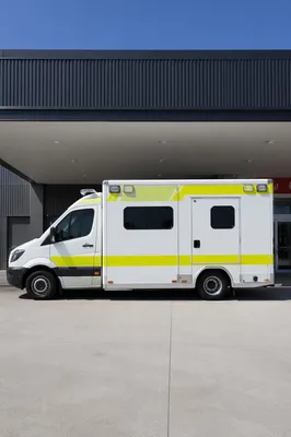 Ambulance Parked at Modern Hospital Entrance