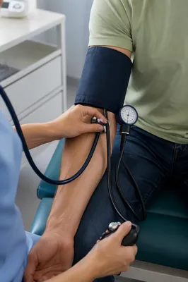 Nurse Checking Patient Blood Pressure Close-Up