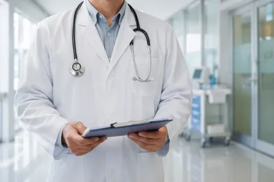 Doctor in White Coat Hospital Corridor