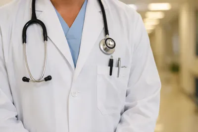 Professional Doctor With Stethoscope in Hospital