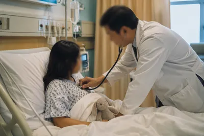 Compassionate Doctor Examining Patient in Hospital