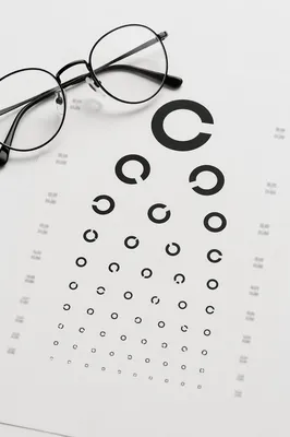 Optometry Vision Chart with Eyeglasses Flat Lay