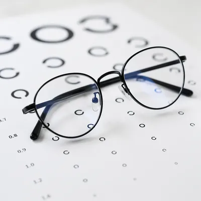 Eyeglasses on Optometry Vision Chart Closeup