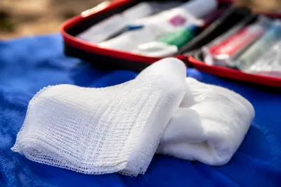 First Aid Gauze on Blue Medical Cloth