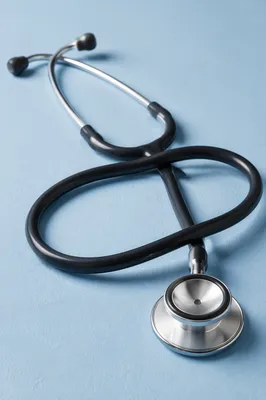 Close-Up Stethoscope on Pastel Blue Surface