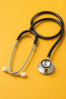 Close-Up Stethoscope on Mustard Background