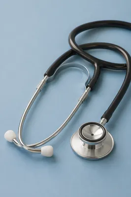 Close-Up Stethoscope on Pastel Blue Surface