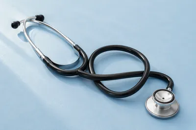 Close-Up Stethoscope on Pastel Blue Surface