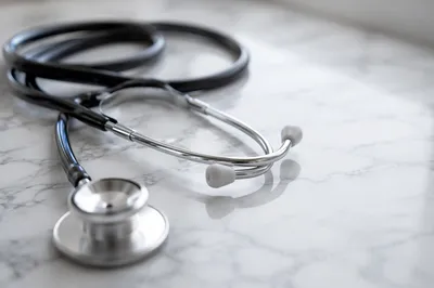 Close-Up Stethoscope on White Marble Surface