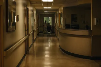 Compassionate Nurse in Quiet Hospital Corridor